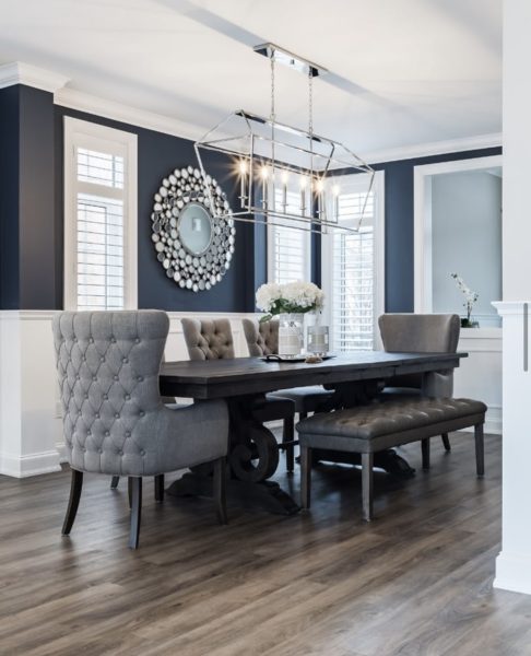 Dining room with dark accent wall.